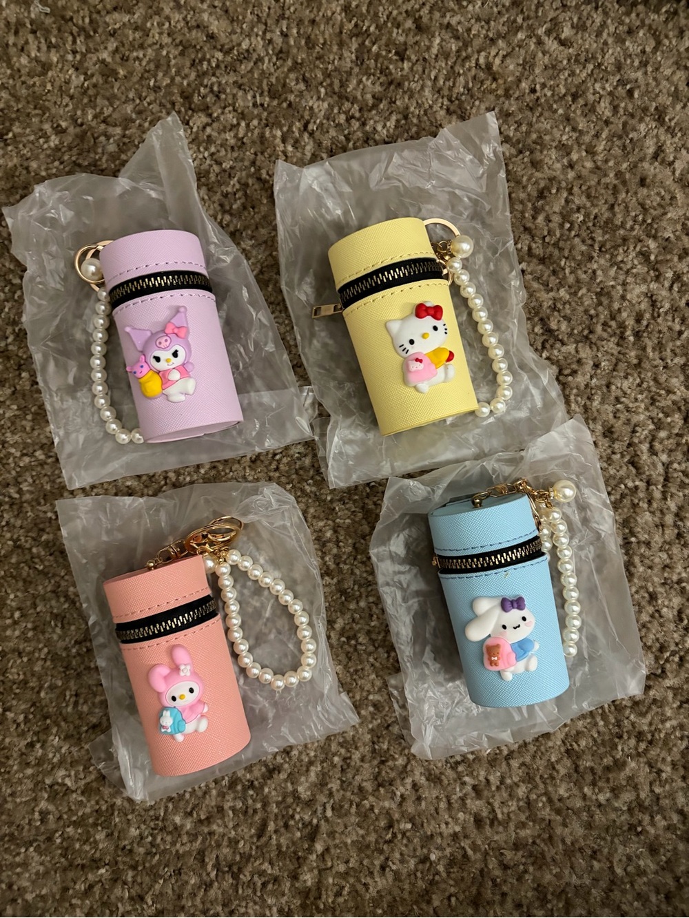 Sanrio Mini Cylinder Cosmetic Bag Keychain - Pink, Lavender, Yellow, Blue